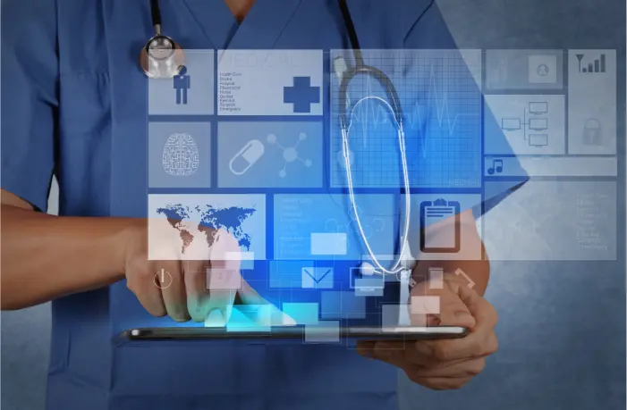 A healthcare professional in blue scrubs uses a tablet device. Various medical icons and symbols, like a stethoscope, world map, and health-related graphics, are digitally overlaid, underscoring the importance of EMR-EHR software in utilizing technology and digital data in modern healthcare